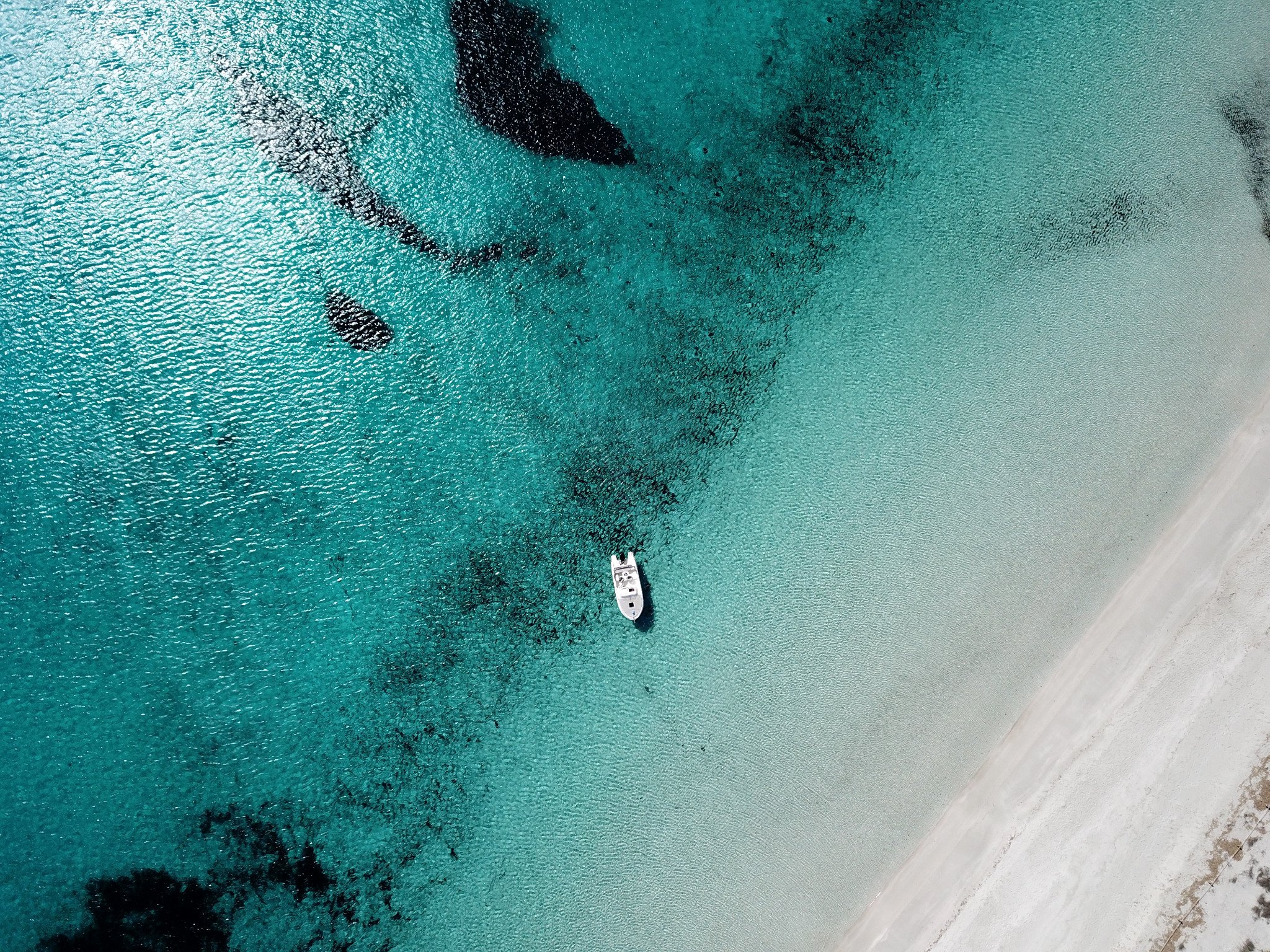 Aerial view of Buena Proa in transparent waters