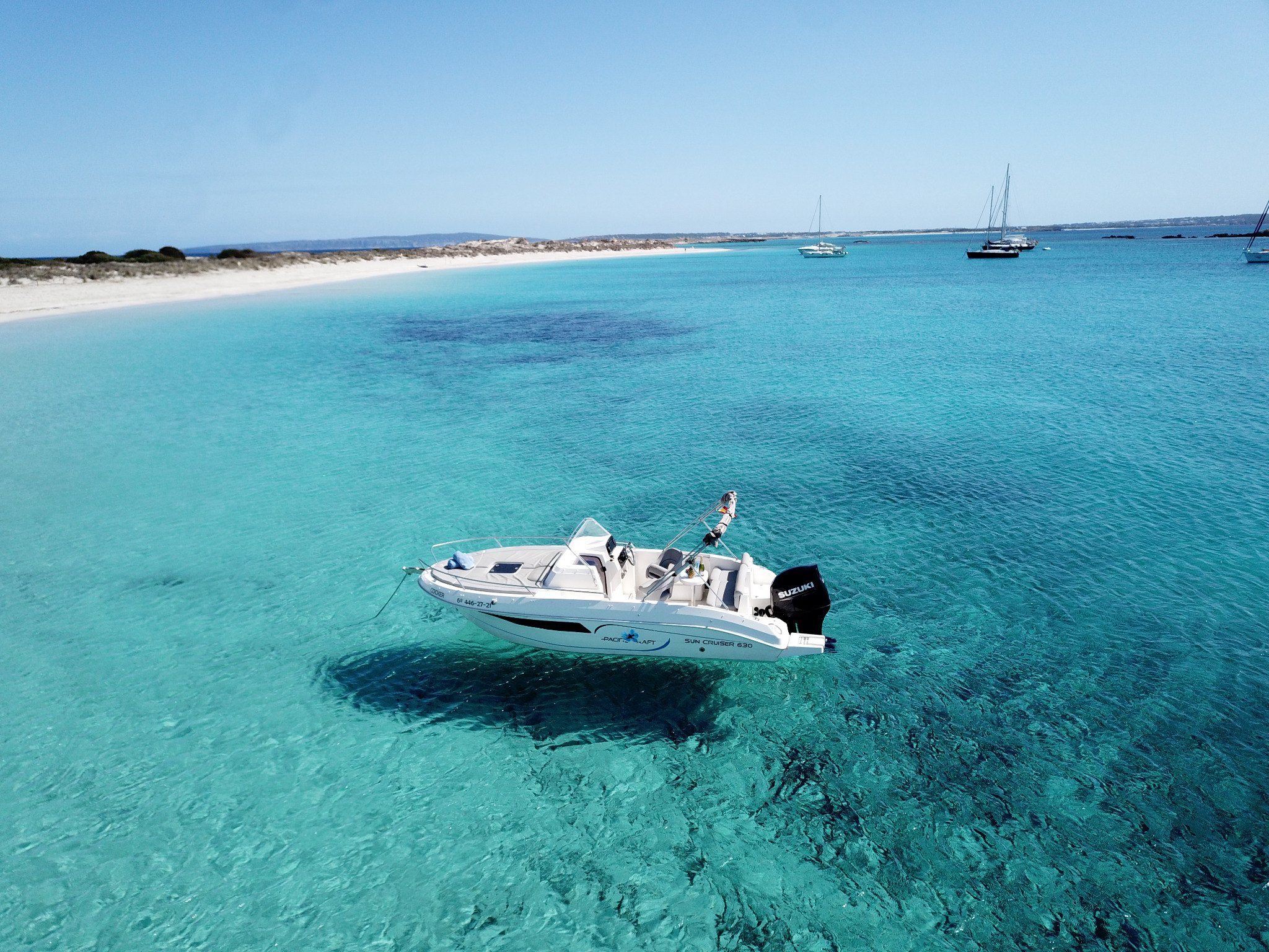 Buena Proa Ibiza anchored in crystal-clear waters