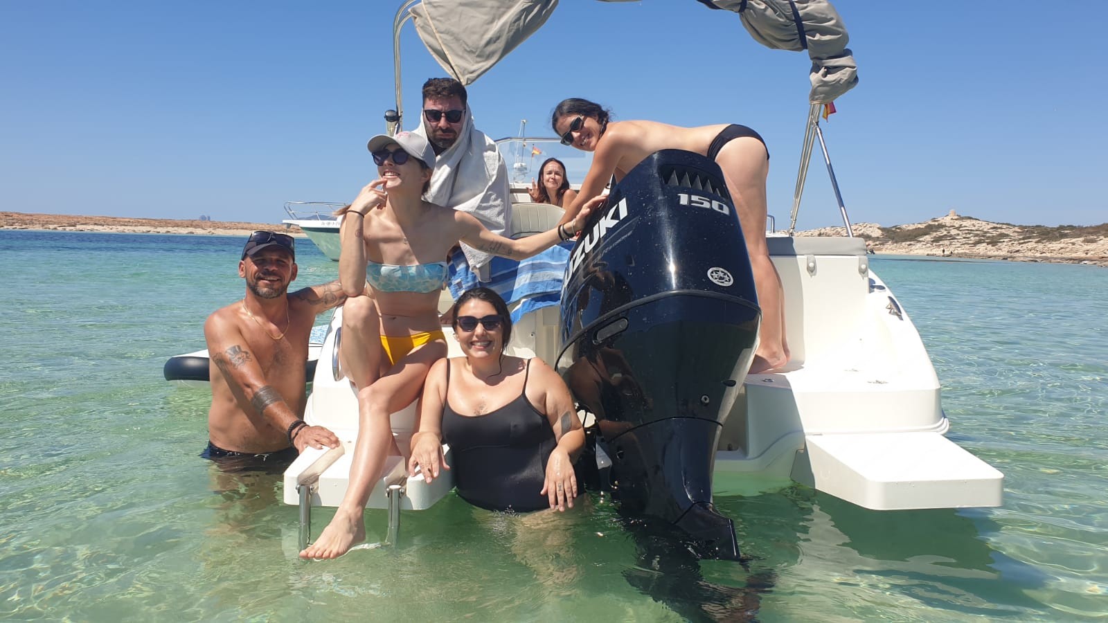Group of friends at the stern of the boat